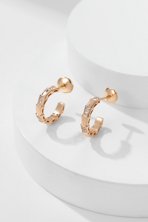 BVSerpentiViper EarringsA seductive and captivating sensuality that pays homage to its spirit animal. Metal and diamonds are spliced with natural stones to give the unique spreading curvature of the spirit snake, with be