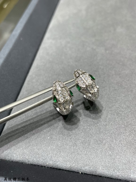 Gold Bvlgari Dodo Snake earrings with emeralds and pavé diamonds The snake as a symbol of sensuality and beauty, a totem that dates back to ancient Greek and Roman mythology, symbolizes intelligence, vitality and charism