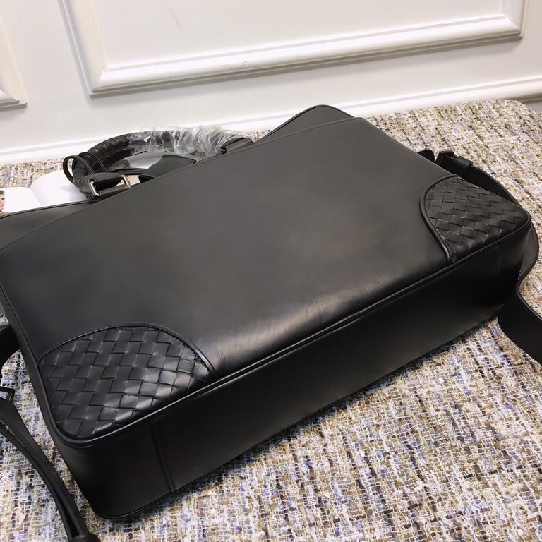 Briefcase  This smooth fetal cowhide leather briefcase features a classic shape with hand-woven handles and trims, fiber lining with a double zipper head, easy access to items, convenient and practical.  Size 39.5x34x8cm