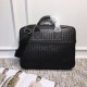 Men's   Tote Briefcase This briefcase is crafted from Italian fetal cowhide leather with hand-woven detailing and is adorned with roomy exterior zippered pockets on both sides. The cotton lined interior has a double zipp