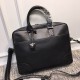 Briefcase  This smooth fetal cowhide leather briefcase features a classic shape with hand-woven handles and trims, fiber lining with a double zipper head, easy access to items, convenient and practical.  Size 39.5x34x8cm