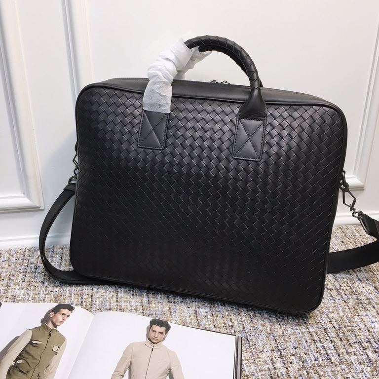 Men's   Tote Briefcase This briefcase is crafted from Italian fetal cowhide leather with hand-woven detailing and is adorned with roomy exterior zippered pockets on both sides. The cotton lined interior has a double zipp