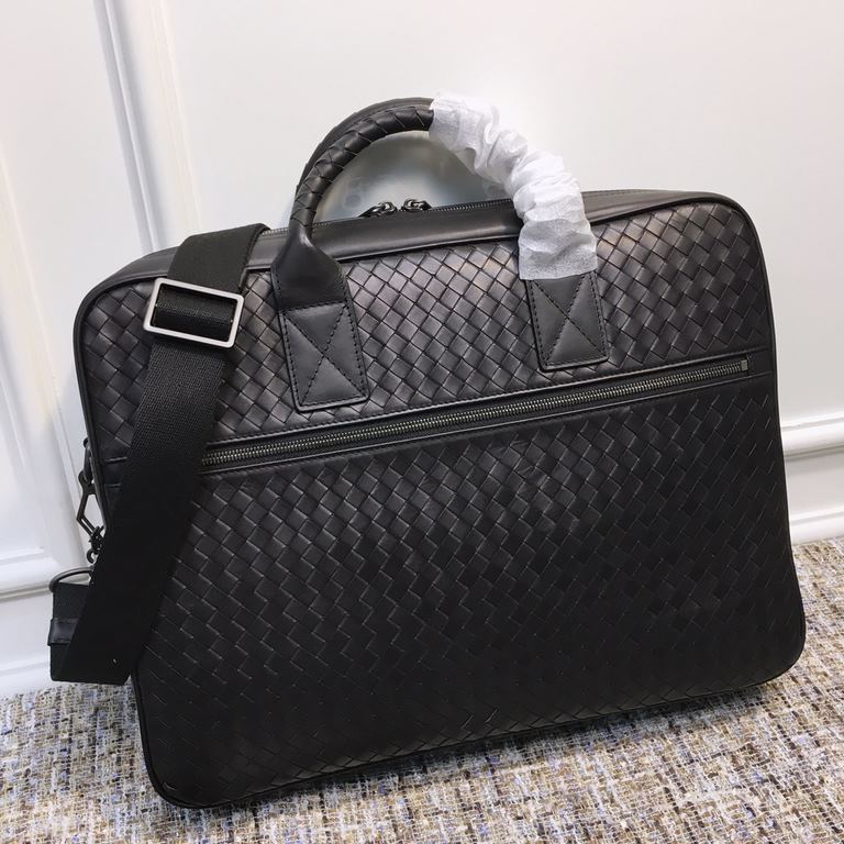 Men's   Tote Briefcase This briefcase is crafted from Italian fetal cowhide leather with hand-woven detailing and is adorned with roomy exterior zippered pockets on both sides. The cotton lined interior has a double zipp