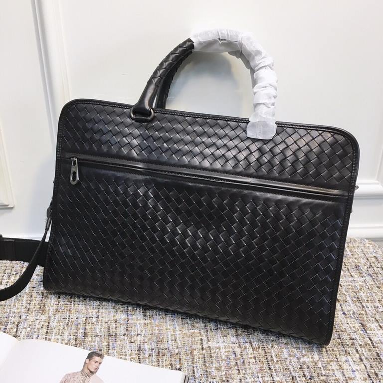 Briefcase   This practical briefcase is meticulously hand-woven and crafted from fetal cowhide leather for a lightweight look that easily organizes all of your daily essentials, from documents to a laptop. The design is 