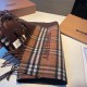 A warm and cozy scarf in soft cashmere. One side is adorned with a Burberry check pattern, while the other features a solid color design and the brand's logo. Produced in a 200-year-old specialist workshop in the Scottis