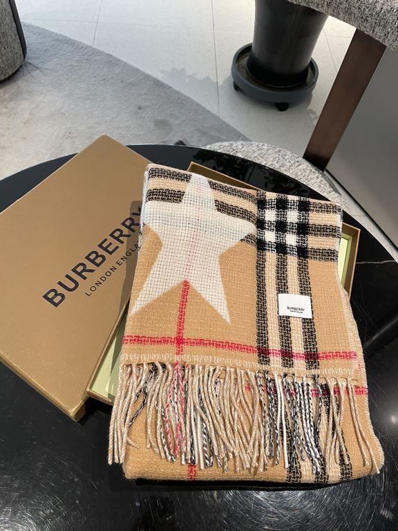 Burberry's Italian-made scarf is crafted from a soft wool-cashmere blend for superior tactility and warmth. Decorated with the exclusive Thomas Burberry logo and decorated with stars and hearts.205 x 40cm