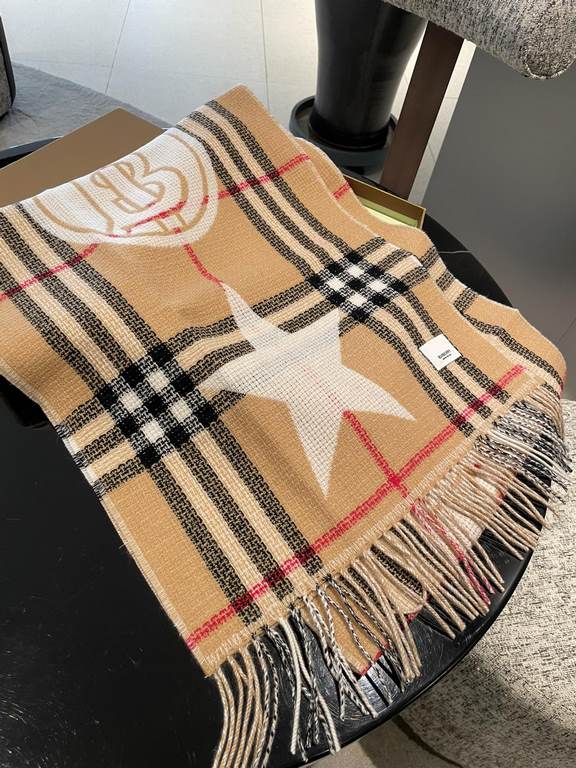 Burberry's Italian-made scarf is crafted from a soft wool-cashmere blend for superior tactility and warmth. Decorated with the exclusive Thomas Burberry logo and decorated with stars and hearts.205 x 40cm