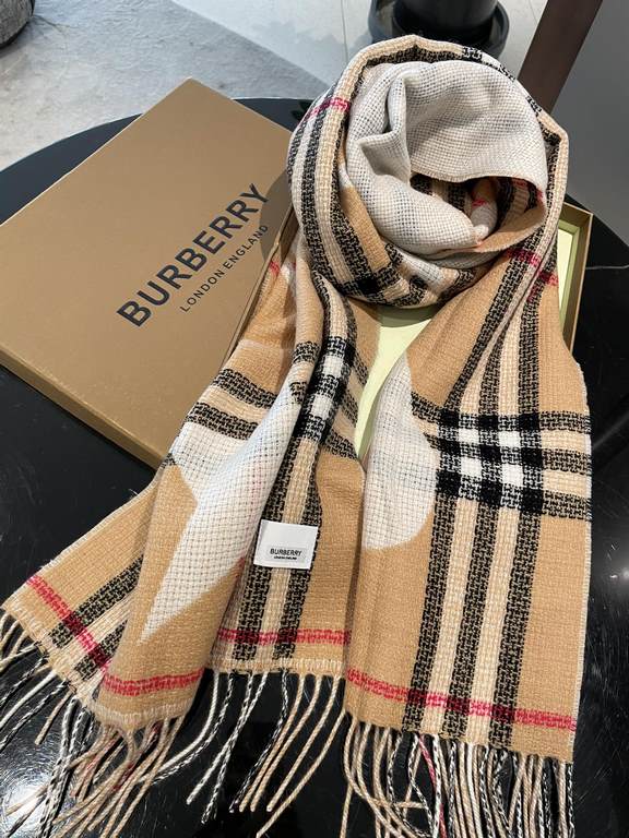 Burberry's Italian-made scarf is crafted from a soft wool-cashmere blend for superior tactility and warmth. Decorated with the exclusive Thomas Burberry logo and decorated with stars and hearts.205 x 40cm