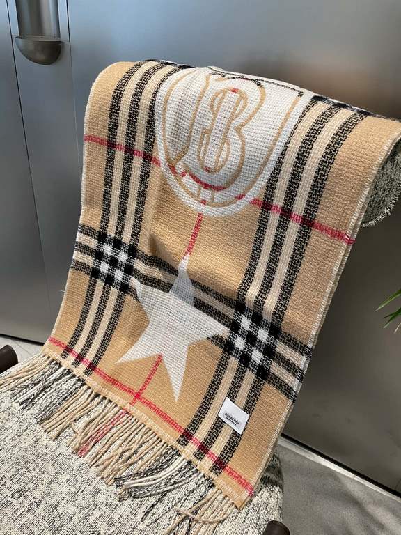 Burberry's Italian-made scarf is crafted from a soft wool-cashmere blend for superior tactility and warmth. Decorated with the exclusive Thomas Burberry logo and decorated with stars and hearts.205 x 40cm