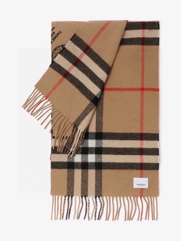 Burberry - Reversible Dual Purpose Label Print Cashmere Scarf    Italian-made scarf crafted from soft cashmere. One side is adorned with Burberry check and the other with a label print that pays homage to the brand's his