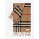 Burberry - Reversible Dual Purpose Label Print Cashmere Scarf    Italian-made scarf crafted from soft cashmere. One side is adorned with Burberry check and the other with a label print that pays homage to the brand's his