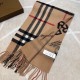 Burberry - Reversible Dual Purpose Label Print Cashmere Scarf    Italian-made scarf crafted from soft cashmere. One side is adorned with Burberry check and the other with a label print that pays homage to the brand's his