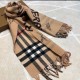 Burberry - Reversible Dual Purpose Label Print Cashmere Scarf    Italian-made scarf crafted from soft cashmere. One side is adorned with Burberry check and the other with a label print that pays homage to the brand's his