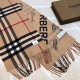 Burberry - Reversible Dual Purpose Label Print Cashmere Scarf    Italian-made scarf crafted from soft cashmere. One side is adorned with Burberry check and the other with a label print that pays homage to the brand's his