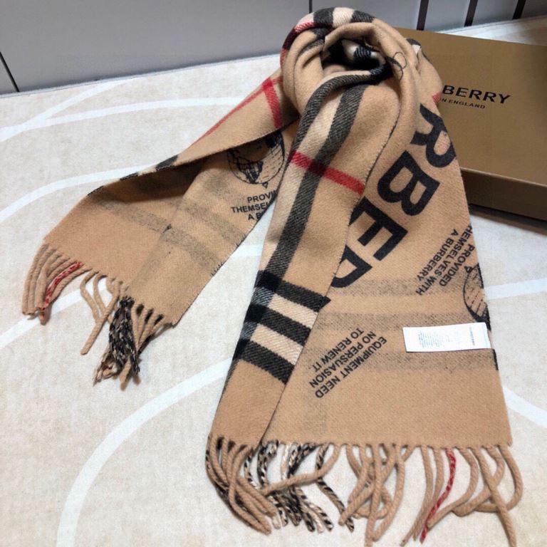 Burberry - Reversible Dual Purpose Label Print Cashmere Scarf    Italian-made scarf crafted from soft cashmere. One side is adorned with Burberry check and the other with a label print that pays homage to the brand's his