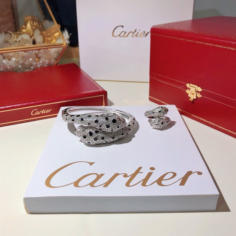 Heavyweight dominant model   Dominant double leopard head full diamond burst bracelet   Panthère de Cartier floral leopard bracelet, 18K white gold  round brilliant diamonds. Emerald, the cheetah - as Cartier's iconic an