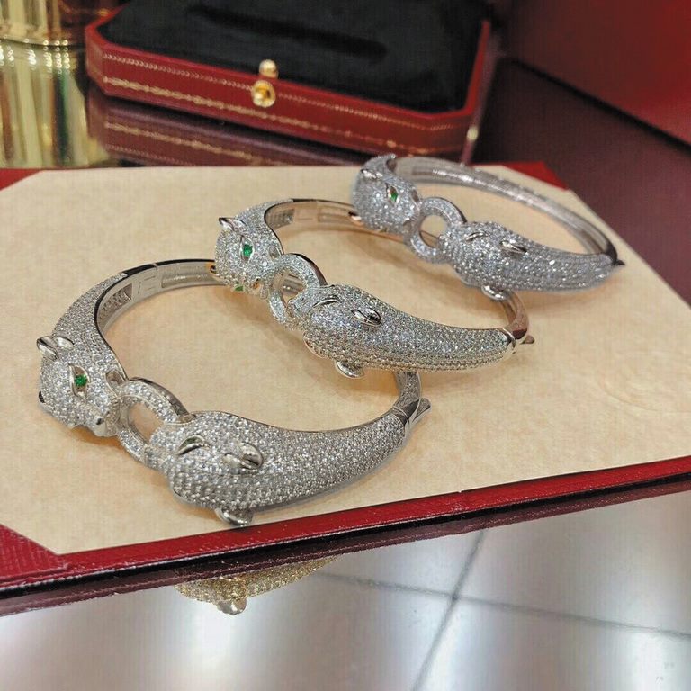 Dominant money double panther head full diamond burst bracelet  Panthère de Cartier floral leopard bracelet, 18K white gold  round brilliant diamonds. Emerald, cheetah - as Cartier's iconic animal figure, first appeared 