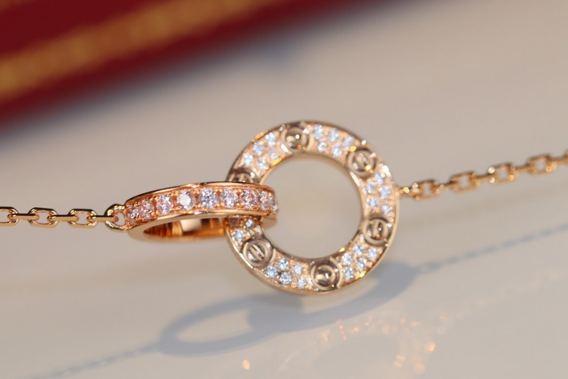 Cartier Necklace Classic Love full diamond big cake double ring necklace. Classic big brand work, the round cake, screws, full of diamonds in one, one side full of diamonds, one side without diamonds, is a very hot one i