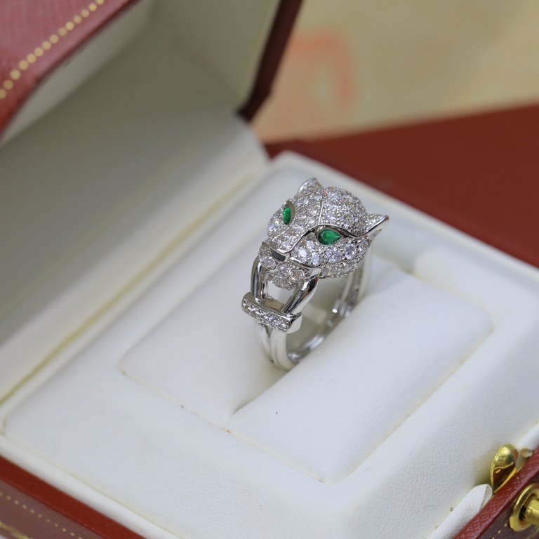 Diamond-set leopard head ring, electroplated 18K yellow gold, tsavorite garnet, onyx. The cheetah - as Cartier's iconic animal figure - first appeared in 1914. Louis Cartier was the first to use the cheetah as a decorati