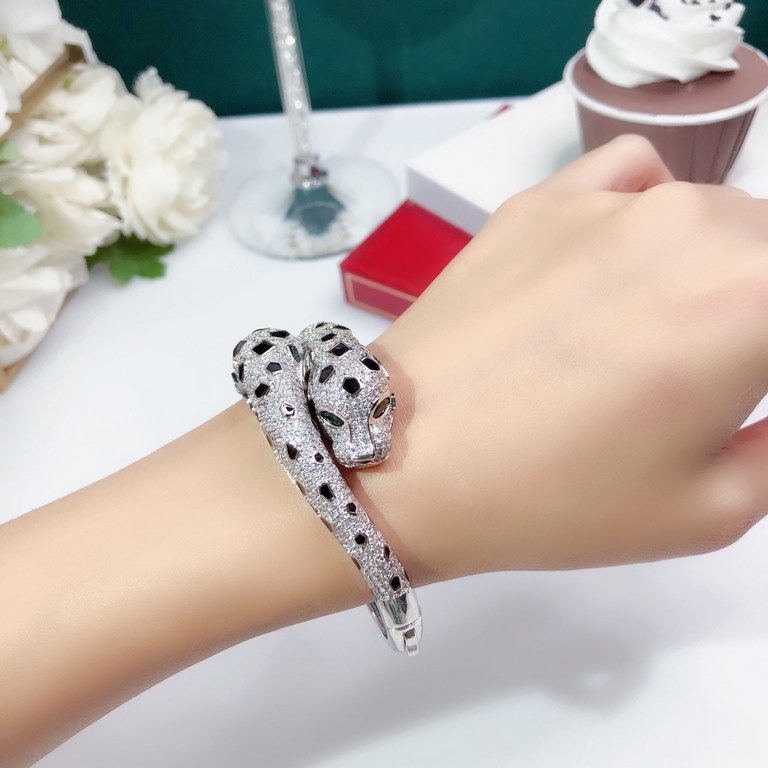 Dominant Double Leopard Head Full Diamond Explosion Bangle  Panthère de Cartier Floral Leopard Bracelet in 18K White Gold    Round Brilliant Cut Diamonds. Emerald, the cheetah - as Cartier's iconic animal figure - first 