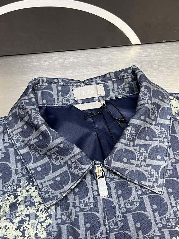 p495 Dior TEARS Floral Zip Jacket CoatExpertly crafted from cotton denim, it's decorated with a laser-drawn Oblique print layered with cotton-shaped detailing that showcases the co-branded collection's Peace Sign motif. 