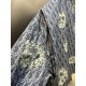 p495 Dior TEARS Floral Zip Jacket CoatExpertly crafted from cotton denim, it's decorated with a laser-drawn Oblique print layered with cotton-shaped detailing that showcases the co-branded collection's Peace Sign motif. 