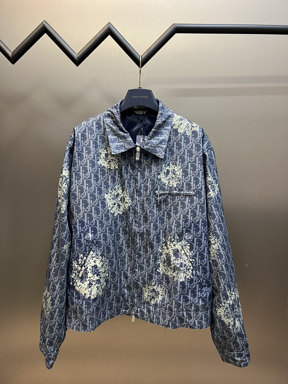 p495 Dior TEARS Floral Zip Jacket CoatExpertly crafted from cotton denim, it's decorated with a laser-drawn Oblique print layered with cotton-shaped detailing that showcases the co-branded collection's Peace Sign motif. 