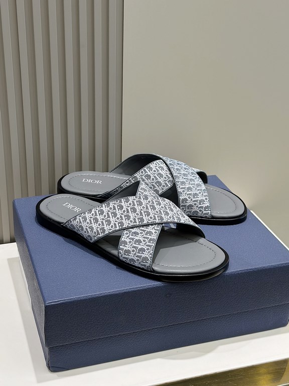 Dior Alias Men's Leather SlippersNew for summer, these Alias sandals make a statement of casual elegance. Crafted from grained cowhide leather, Oblique print fabric and cowhide lining! Cross-strap design with metal overl