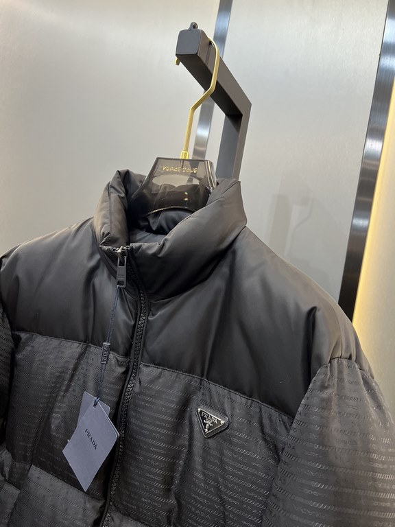 900prada prada new jacquard nylon down jacket metal small label down jacket. The down jacket is made from re-nylon recycled nylon in a modern design that complements the silhouette and features 95% white duck down for wa