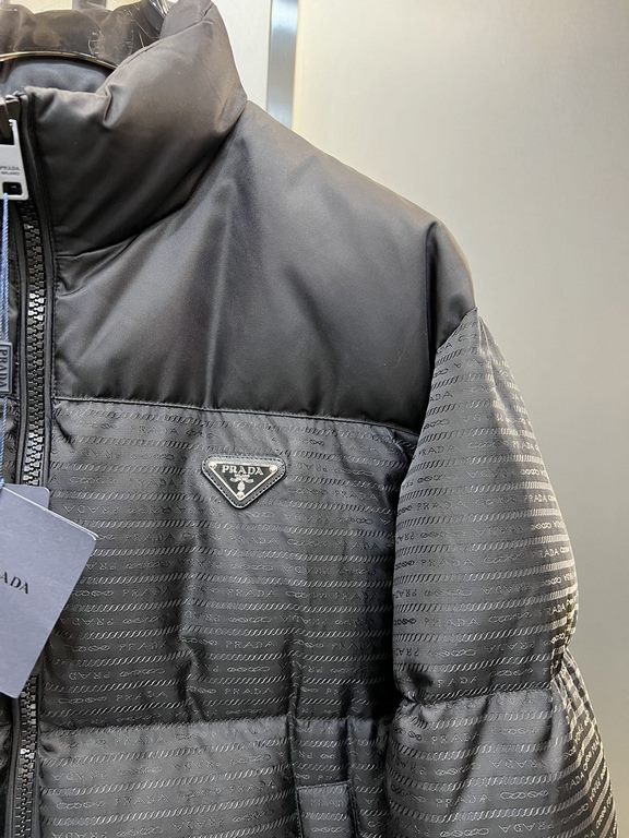 900prada prada new jacquard nylon down jacket metal small label down jacket. The down jacket is made from re-nylon recycled nylon in a modern design that complements the silhouette and features 95% white duck down for wa