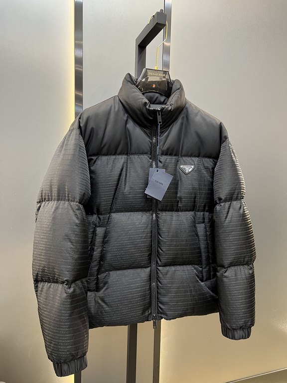 900prada prada new jacquard nylon down jacket metal small label down jacket. The down jacket is made from re-nylon recycled nylon in a modern design that complements the silhouette and features 95% white duck down for wa