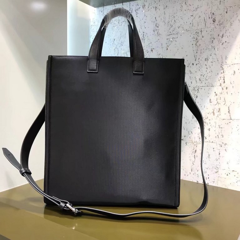 High-quality nylon shopping bag, front lined with calfskin leather trim, decorated with metal eye shape decorations and metal zipper pocket design underneath, with internal small pockets, double-handed carry 35cm.