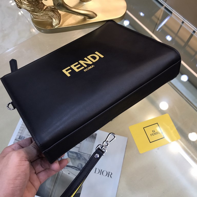 Fendi Fendi Original New Clutch Sharply designed zipper clutch. Made of black Romano leather. Contrasting Fendi lettering patch printed on the bottom side of the Romano leather. Palladium-finish metalwork.Size 27-20-6Mod