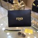 Fendi Fendi Original New Clutch Sharply designed zipper clutch. Made of black Romano leather. Contrasting Fendi lettering patch printed on the bottom side of the Romano leather. Palladium-finish metalwork.Size 27-20-6Mod