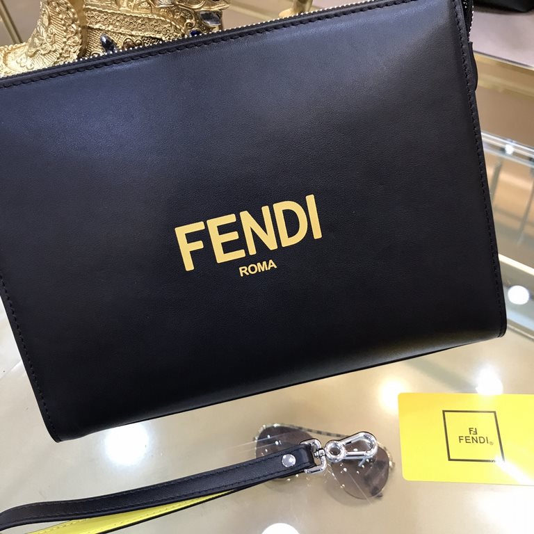 Fendi Fendi Original New Clutch Sharply designed zipper clutch. Made of black Romano leather. Contrasting Fendi lettering patch printed on the bottom side of the Romano leather. Palladium-finish metalwork.Size 27-20-6Mod