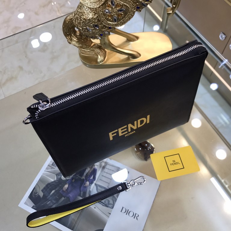 Fendi Fendi Original New Clutch Sharply designed zipper clutch. Made of black Romano leather. Contrasting Fendi lettering patch printed on the bottom side of the Romano leather. Palladium-finish metalwork.Size 27-20-6Mod