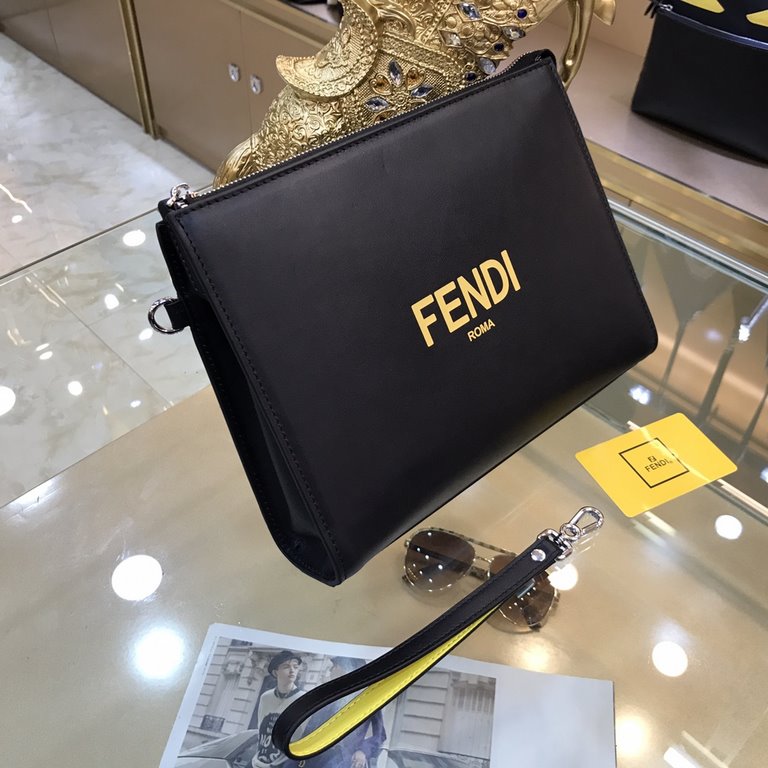 Fendi Fendi Original New Clutch Sharply designed zipper clutch. Made of black Romano leather. Contrasting Fendi lettering patch printed on the bottom side of the Romano leather. Palladium-finish metalwork.Size 27-20-6Mod