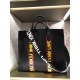 F Home Black nylon and leather tote bag with adjustable shoulder strap and double handles wrapped around the bag in black, red and yellow rubber appliqués inspired by the theme F VOCABULARY, zippered inside pocket.391935