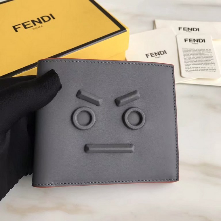 F family folding wallet in gray calfskin with appliquéd speechless emoji, lined with eight card slots and two cash compartments.