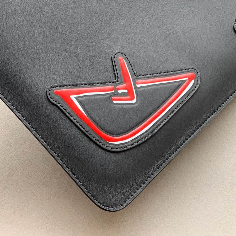 F family clutch bag in thin calfskin leather, embossed with a color-printed eye shape, zipper closure and engraved with the F logo on the back. 30.20cm