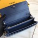 Long wallet in calfskin leather decorated with conical rivets and metal rings, with 2 crotch-access compartments, 1 zipper pocket, 10 card slots and side-opening pockets, and detachable chain shoulder strap.19cm (boxed g