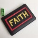 F family thin clutch bag in black calf leather with F and FAITH lettering on the back with F VOCABULARY-inspired appliqués and multicolored rubber details. 30cm.