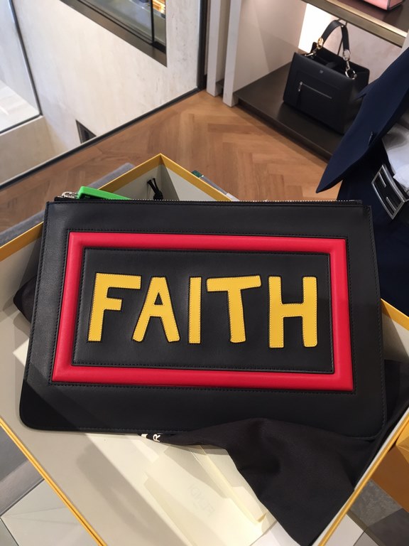 F family thin clutch bag in black calf leather with F and FAITH lettering on the back with F VOCABULARY-inspired appliqués and multicolored rubber details. 30cm.