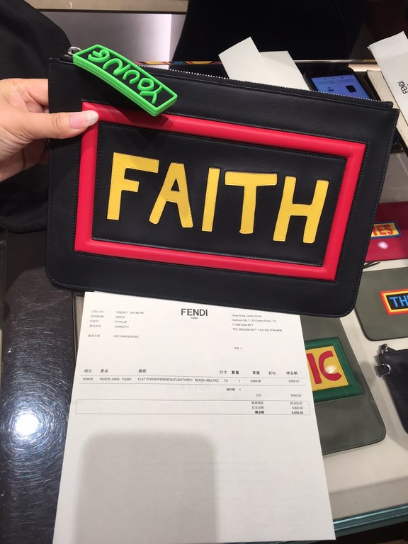 F family thin clutch bag in black calf leather with F and FAITH lettering on the back with F VOCABULARY-inspired appliqués and multicolored rubber details. 30cm.