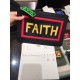 F family thin clutch bag in black calf leather with F and FAITH lettering on the back with F VOCABULARY-inspired appliqués and multicolored rubber details. 30cm.