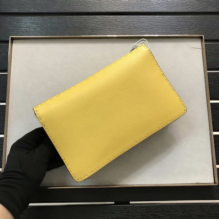 F Lychee leather clutch bag with raw feel cut edges, hand-stitching, black piping, color-blocked sides, lined interior, featuring 8 card compartments and 1 wide crotch-accessible pocket. 24cm.