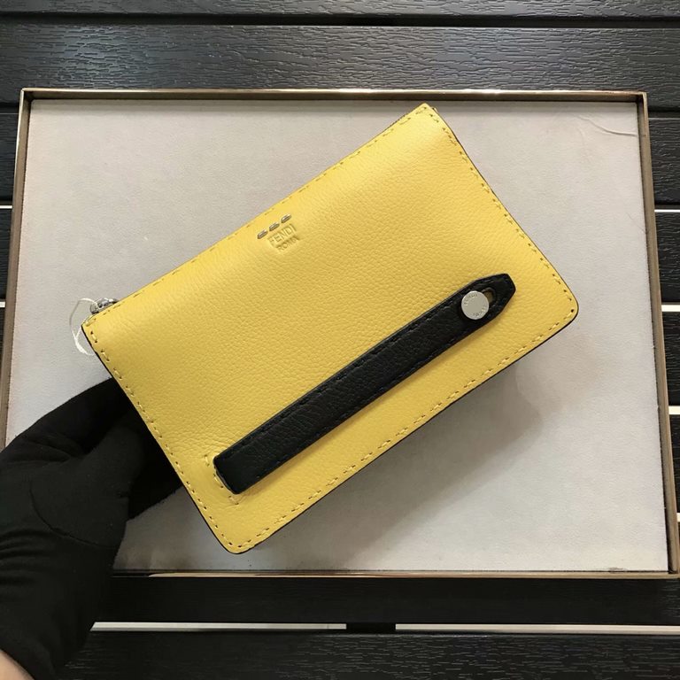 F Lychee leather clutch bag with raw feel cut edges, hand-stitching, black piping, color-blocked sides, lined interior, featuring 8 card compartments and 1 wide crotch-accessible pocket. 24cm.