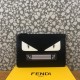 Upgraded Clutch   Thin black calf leather clutch bag decorated with black and white Bag Bugs eye shape embossed inlays. Zipper closure. F logo on the back. Add a wristlet for added practicality. Made in Italy Size 29x19x