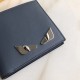 F Home Gray-blue plain leather cross-body wallet decorated with metal eyes, with eight card slots and two billfold pockets.