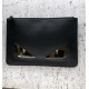 Clutch bag in calf leather, decorated with a BAG BUGS eye shape made of metal appliqués and a logo on the back. 30 cm.